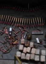 В зоні АТО СБУ викрила схованку боєприпасів (фото)